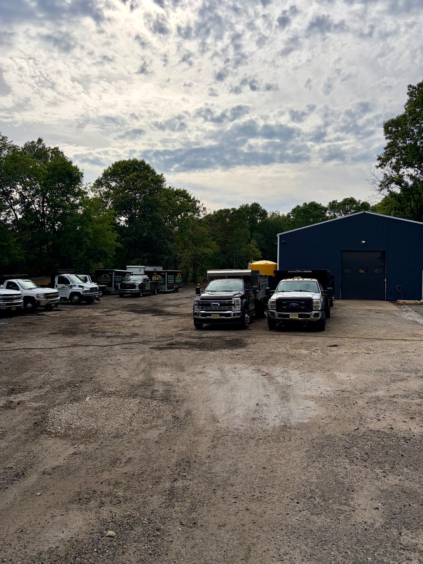 Blue Anchor Detailing commercial fleet program — a group of service trucks detailed on site