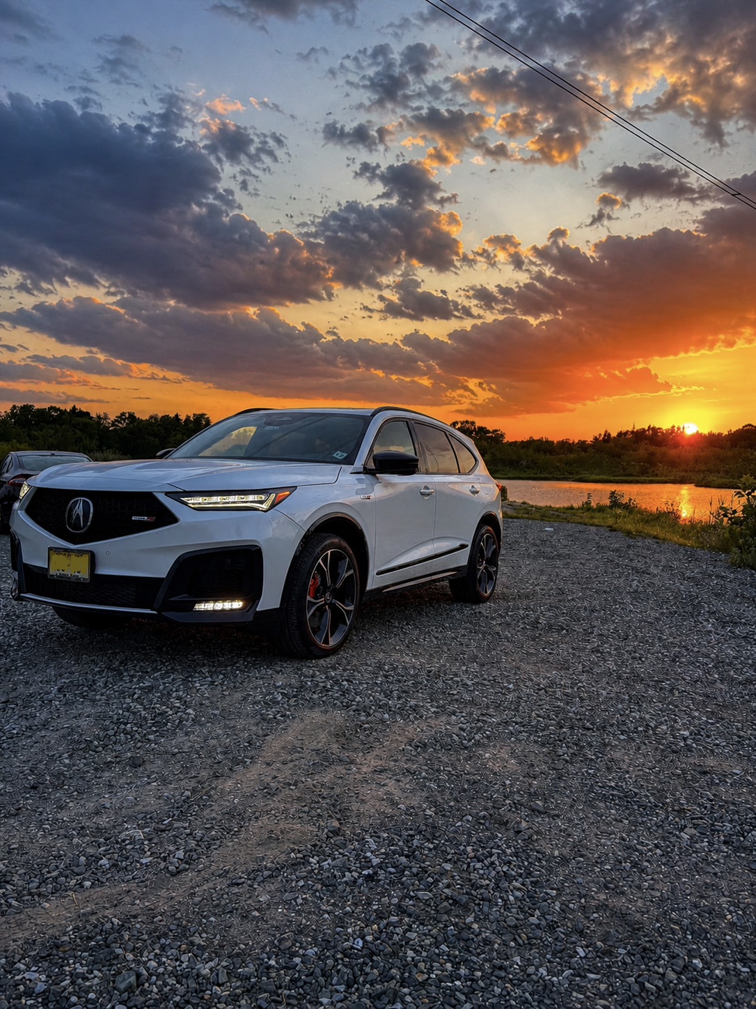 White Acura MDX Type S detailed at sunset